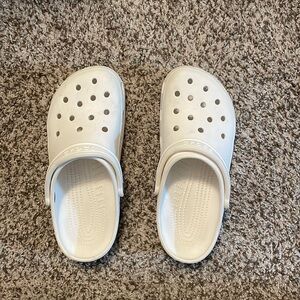 Women’s white crocs.
